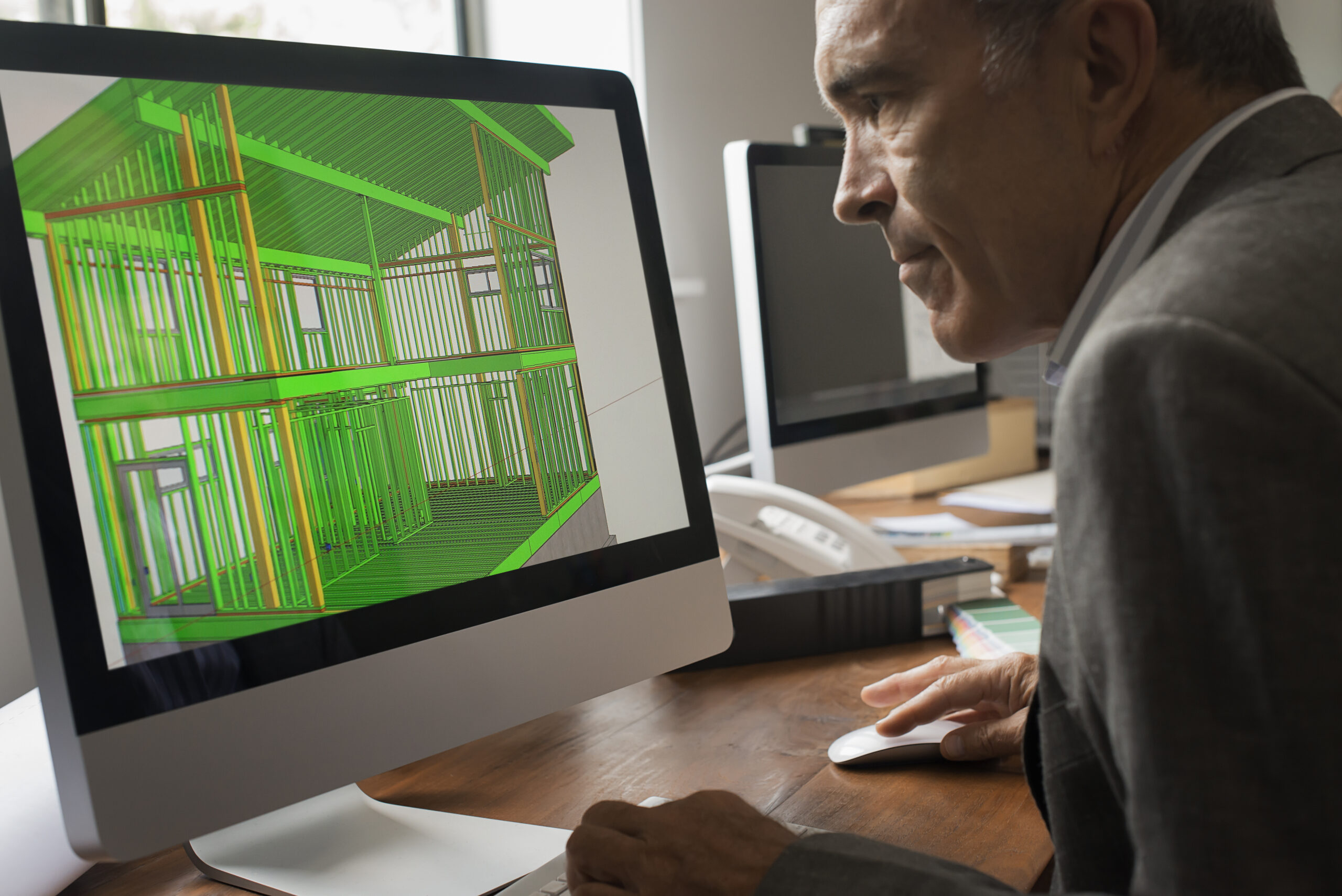 Architects discussing a green construction project, designing and building efficient environmentally friendly buildings. Green architectural practice.